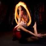 Captivating ballet dance with dramatic fire effects showcasing flexibility and grace.
