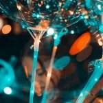 Colorful bokeh effect with balloons and party lights creating a festive atmosphere.