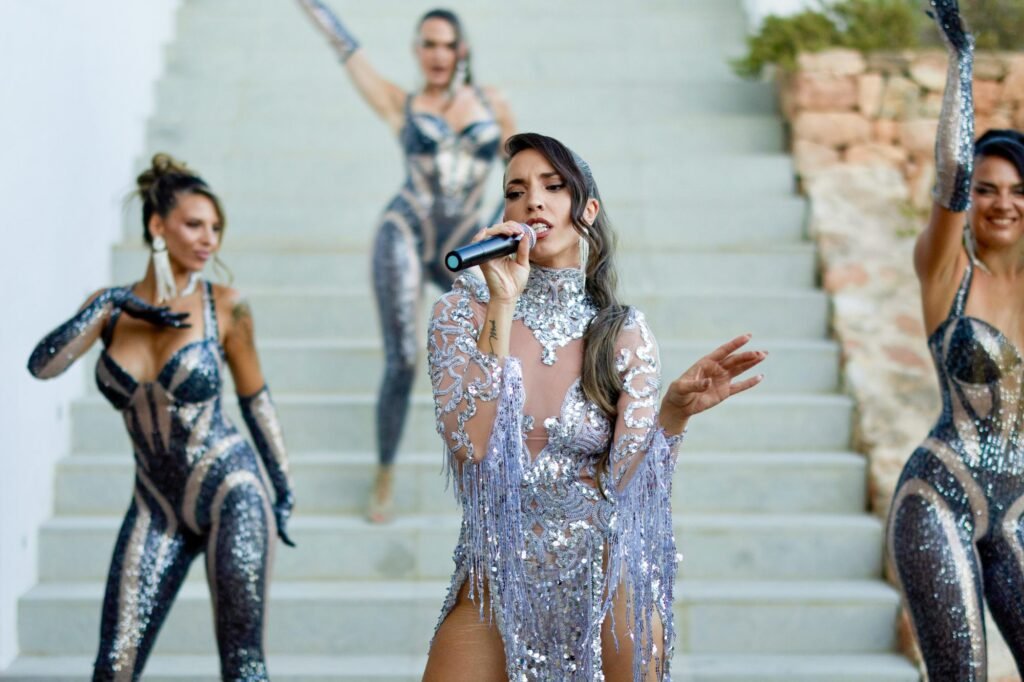 Live singer performance in sequin costume, Ibiza luxury entertainment