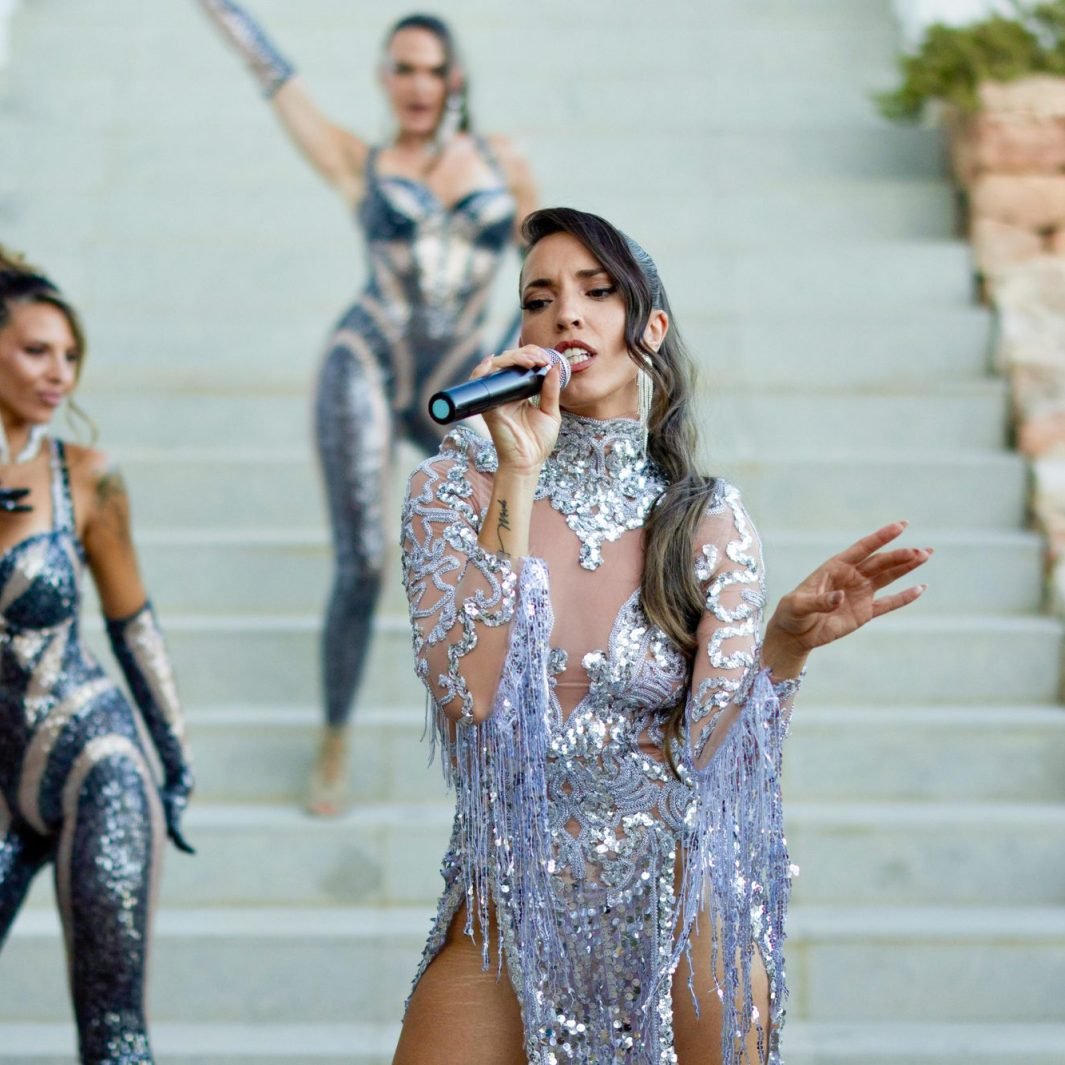 Live singer performance in sequin costume, Ibiza luxury entertainment